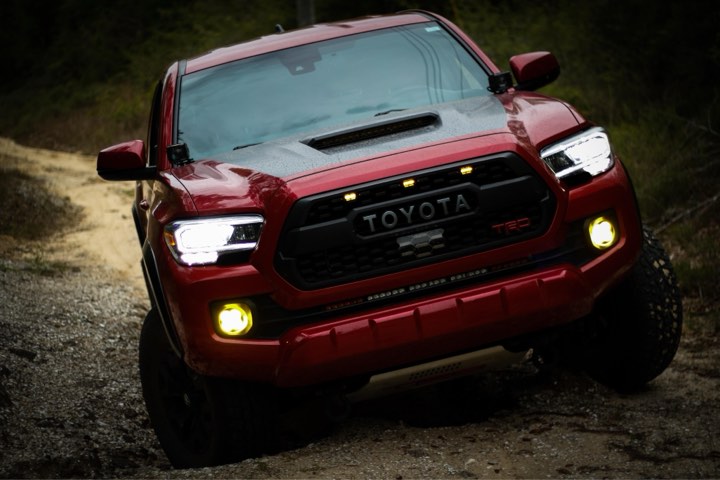  Red  Toyota Tacoma flexing on uneven terrain